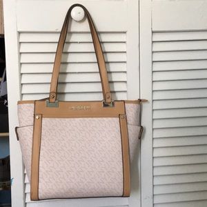 Cream purse with light brown accents.